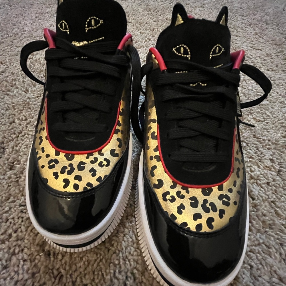 Puma Black and Gold Sneakers